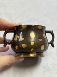 A Chinese gold-splashed bronze censer with two handles, Xuande mark, 18th C.
