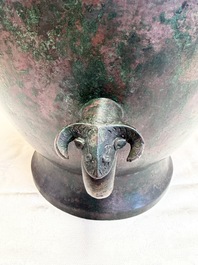 A large Chinese archaistic bronze wine vessel and cover with ram-form handles, Lei 罍, Ming
