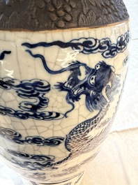 A pair of Chinese blue and white Nanking crackle-glazed 'Dragons' vases, 19th C.