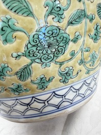 A rare pair of Chinese famille verte yellow-ground 'Flower Scroll' covered vases, Kangxi