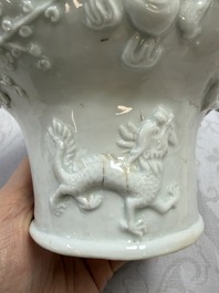 A very large Chinese Dehua blanc de Chine libation cup with a dragon, a qilin, a tiger and a crane, 18th C.