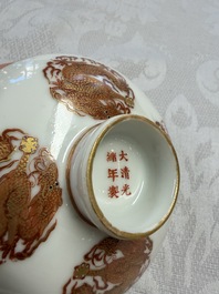 A fine Chinese iron-red gilt-decorated covered teabowl with a stand, Guangxu mark and of the period