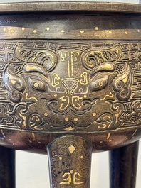 A rare Chinese gold- and silver-inlaid bronze 'Ding' censer with Taotie design on a hongmu stand, Shaosheng 紹聖 and Su Zhe 蘇轍 mark, Song or later