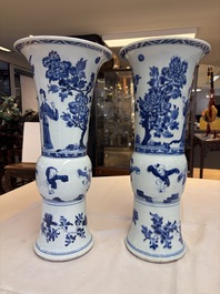 A pair of large Chinese blue and white 'Gu' vases with elegant ladies and playing boys, Kangxi