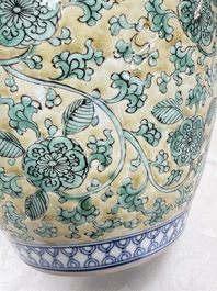 A rare pair of Chinese famille verte yellow-ground 'Flower Scroll' covered vases, Kangxi