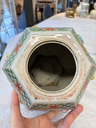 A pair of Chinese famille rose 'Antiquities' vases and covers, 19th C.