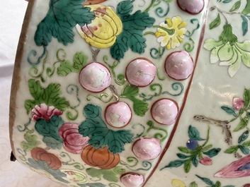 A Chinese famille rose garden seat with butterflies, flowers and fruiting branches, 19th C.