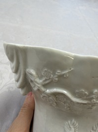 A very large Chinese Dehua blanc de Chine libation cup with a dragon, a qilin, a tiger and a crane, 18th C.