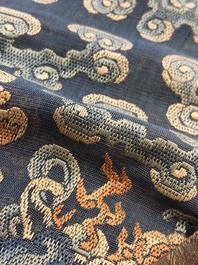 A Chinese silk blue-ground summer gauze 'Dragons' robe, 19th C.