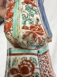 A rare Chinese wucai figure of a dignitary, late Ming/Transitional period