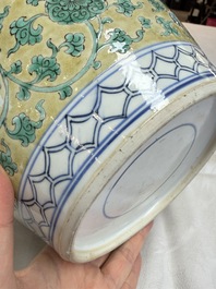 A rare pair of Chinese famille verte yellow-ground 'Flower Scroll' covered vases, Kangxi