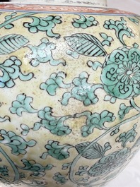 A rare pair of Chinese famille verte yellow-ground 'Flower Scroll' covered vases, Kangxi