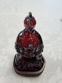 A rare complete set of 12 Chinese cherry amber 'Zodiac' figures on wooden stands, Qianlong mark, Republic