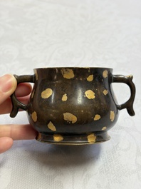 A Chinese gold-splashed bronze censer with two handles, Xuande mark, 18th C.