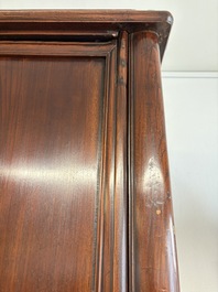 A large Chinese elmwood tapered round-corner cabinet, 'Yuanjiaogui', early Qing, 17/18th C.
