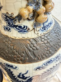 A pair of Chinese blue and white Nanking crackle-glazed 'Dragons' vases, 19th C.