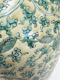 A rare pair of Chinese famille verte yellow-ground 'Flower Scroll' covered vases, Kangxi