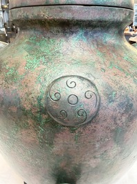 A large Chinese archaistic bronze wine vessel and cover with ram-form handles, Lei 罍, Ming