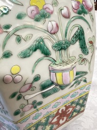 A pair of Chinese famille rose 'Antiquities' vases and covers, 19th C.