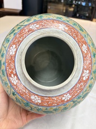 A rare pair of Chinese famille verte yellow-ground 'Flower Scroll' covered vases, Kangxi