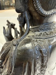 A fine Chinese bronze figure of Bodhisattva holding a ruyi, Ming