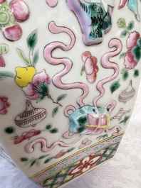 A pair of Chinese famille rose 'Antiquities' vases and covers, 19th C.