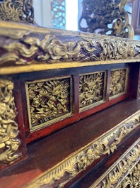 An exceptional Vietnamese gilt-lacquered wood and ivory 'Dragon and Phoenix' throne-shaped altar, 18/19th C.