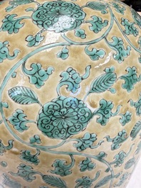 A rare pair of Chinese famille verte yellow-ground 'Flower Scroll' covered vases, Kangxi