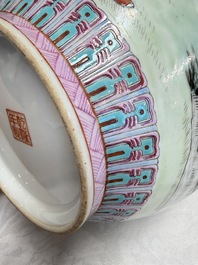 A pair of Chinese famille rose bottle vases, Qianlong mark, 20th C.