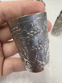A Chinese Canton or Vietnamese silver bottle vase with landscape design and six cups, 19th C.