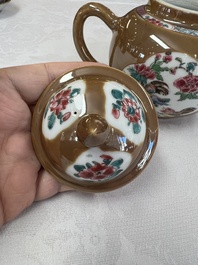 A Chinese famille rose capucine-ground covered teapot with floral design, seven cups and saucers, Yongzheng/Qianlong