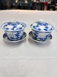 A pair of Chinese inscribed blue and white 'Clouds' tea bowls, covers and stands, Guangxu mark and of the period