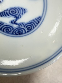A pair of Chinese inscribed blue and white 'Clouds' tea bowls, covers and stands, Guangxu mark and of the period