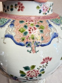 A pair of Chinese famille rose 'Phoenixes among Flowering Branches' vases and covers, 20th C.