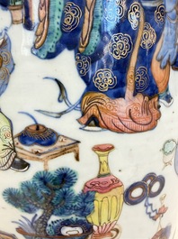 A Chinese doucai and famille rose rouleau vase with figures among antiquities, 19th C.