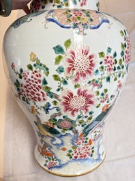 A pair of Chinese famille rose 'Phoenixes among Flowering Branches' vases and covers, 20th C.