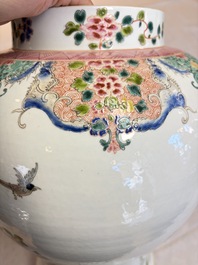 A pair of Chinese famille rose 'Phoenixes among Flowering Branches' vases and covers, 20th C.