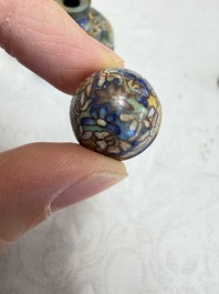 A collection of 12 Chinese cloisonn&eacute; snuff bottles with floral design, 19/20th C.