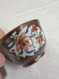 A Chinese famille rose capucine-ground covered teapot with floral design, seven cups and saucers, Yongzheng/Qianlong