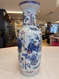 A Chinese doucai and famille rose rouleau vase with figures among antiquities, 19th C.