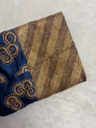 A Chinese embroidered silk blue-ground 'Dragons' robe, adapted into a lady's dress, 19th C. and later