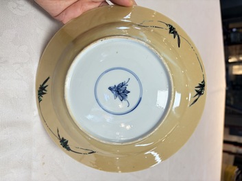 A pair of Chinese famille verte caf&eacute;-au-lait-ground plates with floral design, lotus mark, Kangxi