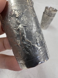 A Chinese Canton or Vietnamese silver bottle vase with landscape design and six cups, 19th C.