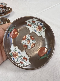 A Chinese famille rose capucine-ground covered teapot with floral design, seven cups and saucers, Yongzheng/Qianlong
