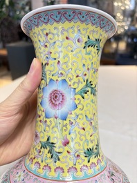 A pair of Chinese famille rose bottle vases, Qianlong mark, 20th C.