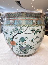 A pair of Chinese famille verte 'Flowers and Butterflies' fishbowls, 19th C.