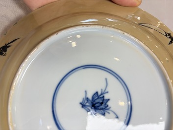 A pair of Chinese famille verte caf&eacute;-au-lait-ground plates with floral design, lotus mark, Kangxi