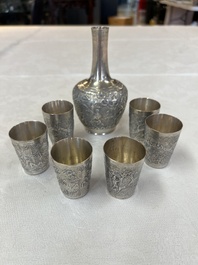 A Chinese Canton or Vietnamese silver bottle vase with landscape design and six cups, 19th C.