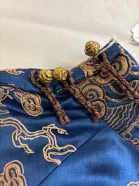 A Chinese embroidered silk blue-ground 'Dragons' robe, adapted into a lady's dress, 19th C. and later