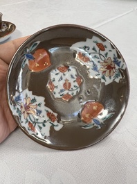 A Chinese famille rose capucine-ground covered teapot with floral design, seven cups and saucers, Yongzheng/Qianlong